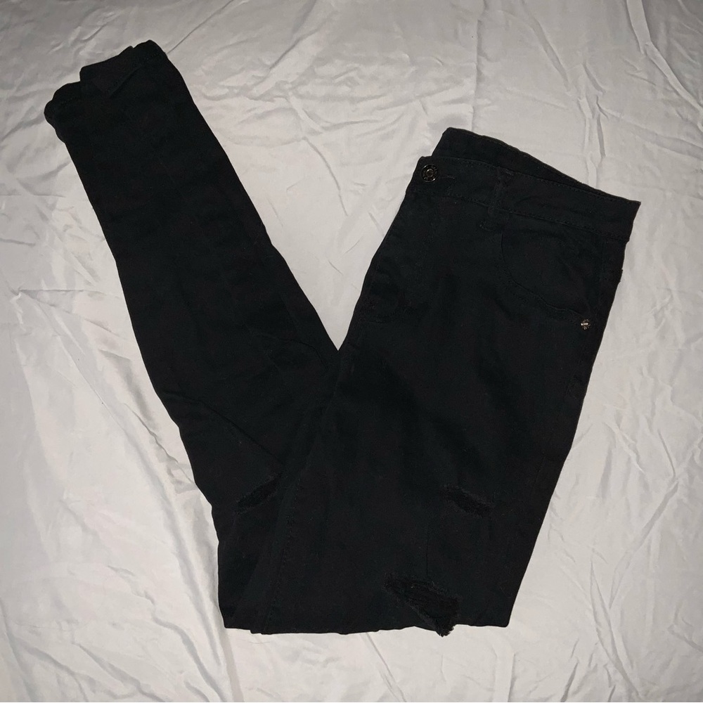 Black high waisted skinny jeans with a few tears NEVER WORN!! NEW WITHOUT TAGS